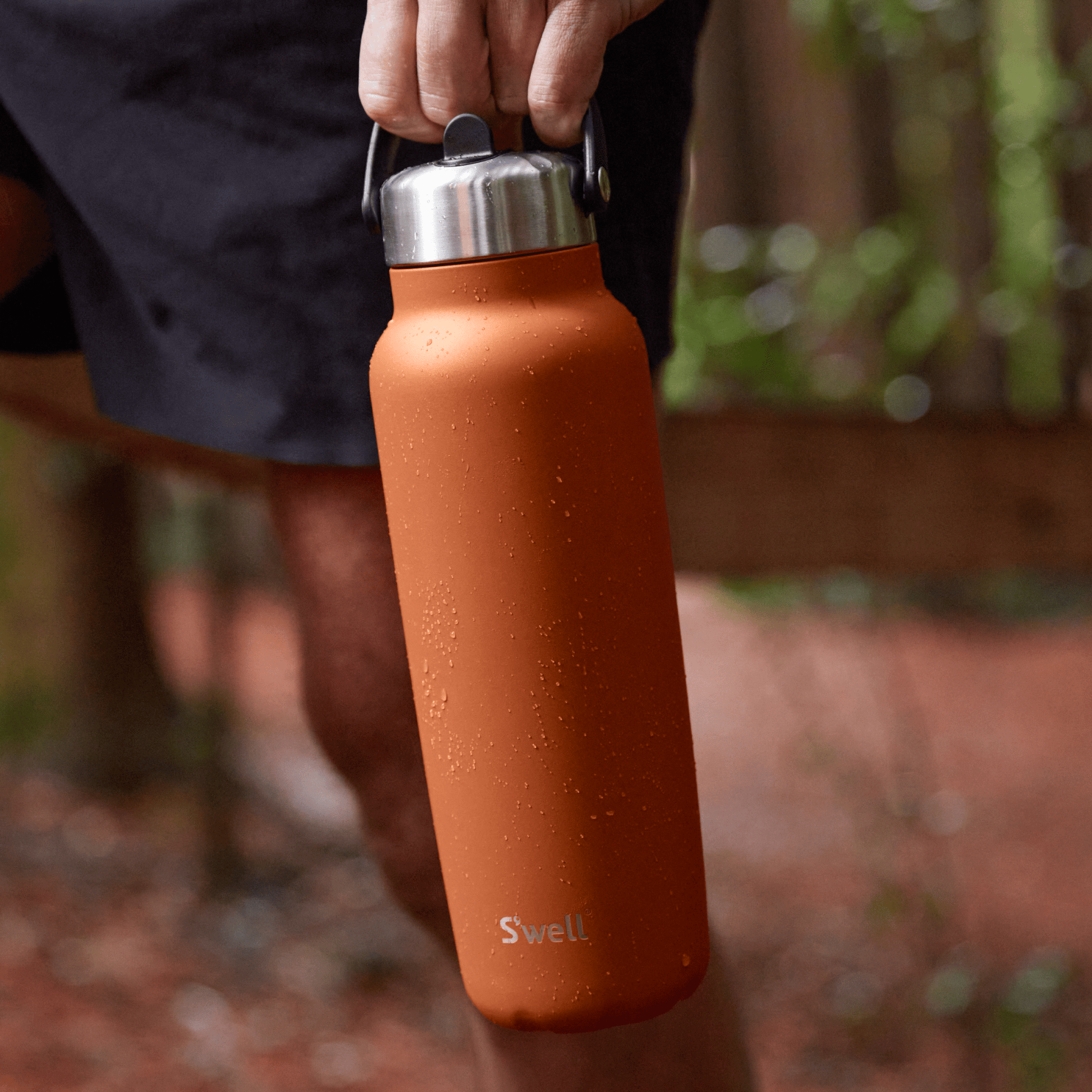 explorer-with-flip-straw-lid-40oz-k4 Swell-Explorer-Water-Bottle-40oz-Orange-Carnelian-LifeStyle.png