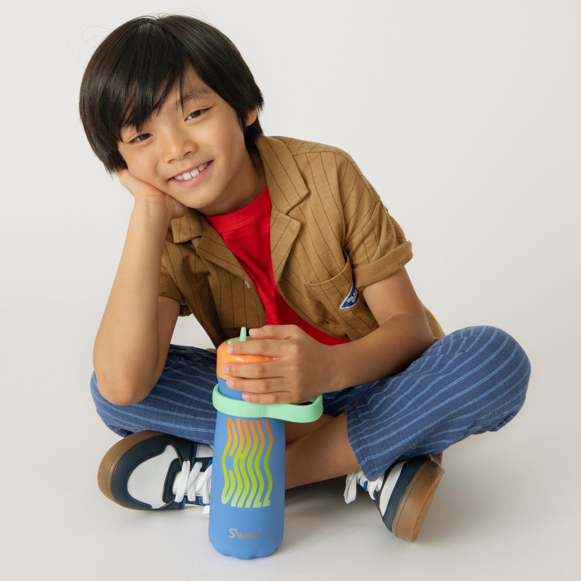 traveler-with-flip-straw-lid-16oz-l6 Swell-Kids-Water-Bottle-Traveler-16oz-Blue-Chill-Lifestyle.jpg
